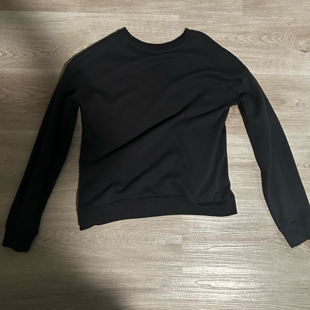Plain black sweatshirt. Kids XXL but fits women like a S/M